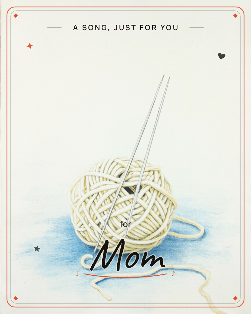 A single ball of cream-coloured wool sits on a pale blue-shadowed surface, two slender knitting needles standing upright in its centre, a any occasion e-card design