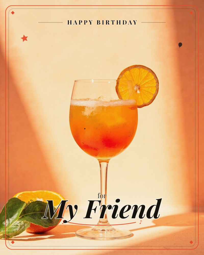 A stemmed glass of an orange spritz cocktail sits in warm, low sunlight, ice cubes glinting inside and a round orange slice perched on the rim, a birthday e-card design