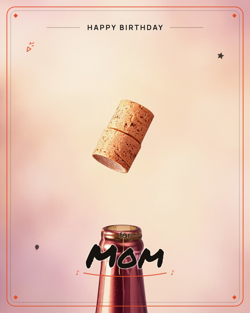 A champagne cork hangs mid-air just after popping, tumbling above the open neck of a rose-gold bottle, a birthday e-card design