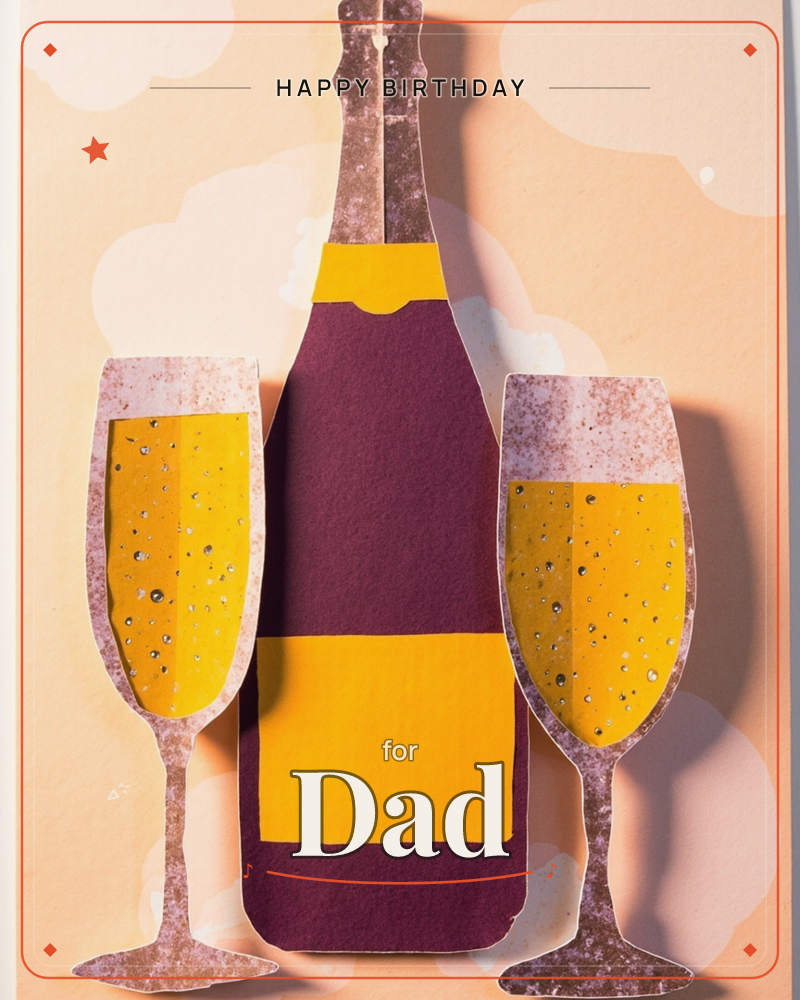 A cut-paper champagne bottle stands between two filled flutes, all crafted from layered paper with a speckled, textured finish that catches soft studio…, a birthday e-card design