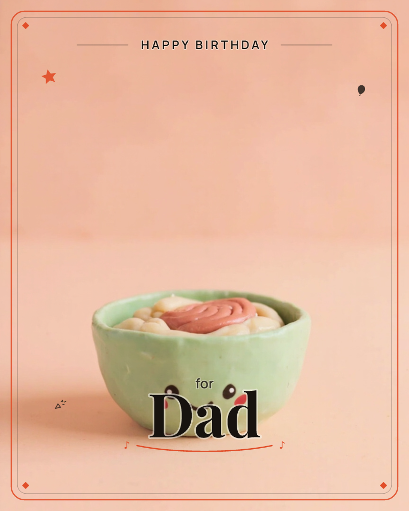 A small green ceramic bowl with a cheerful painted face, rosy cheeks and a happy smile, sits filled with what looks like a swirl of pink frosting…, a birthday e-card design