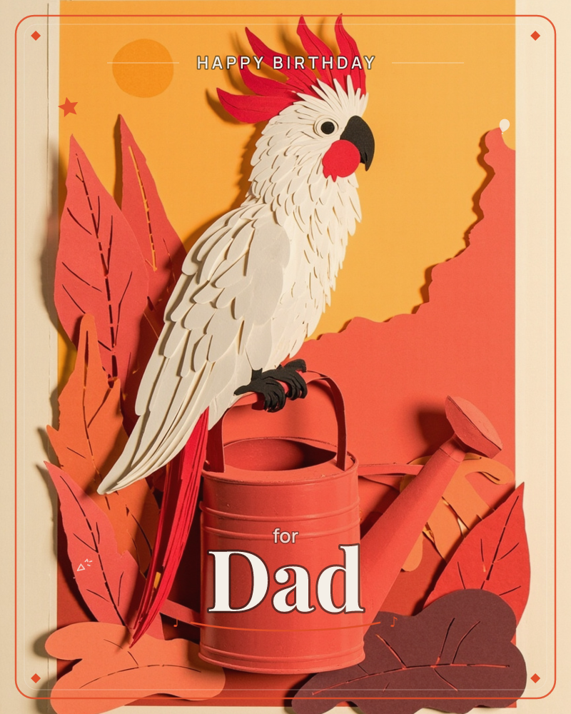 A paper-craft cockatoo with a fan of crimson crest feathers perches on the handle of a small watering can, set against layered paper leaves and a warm…, a birthday e-card design