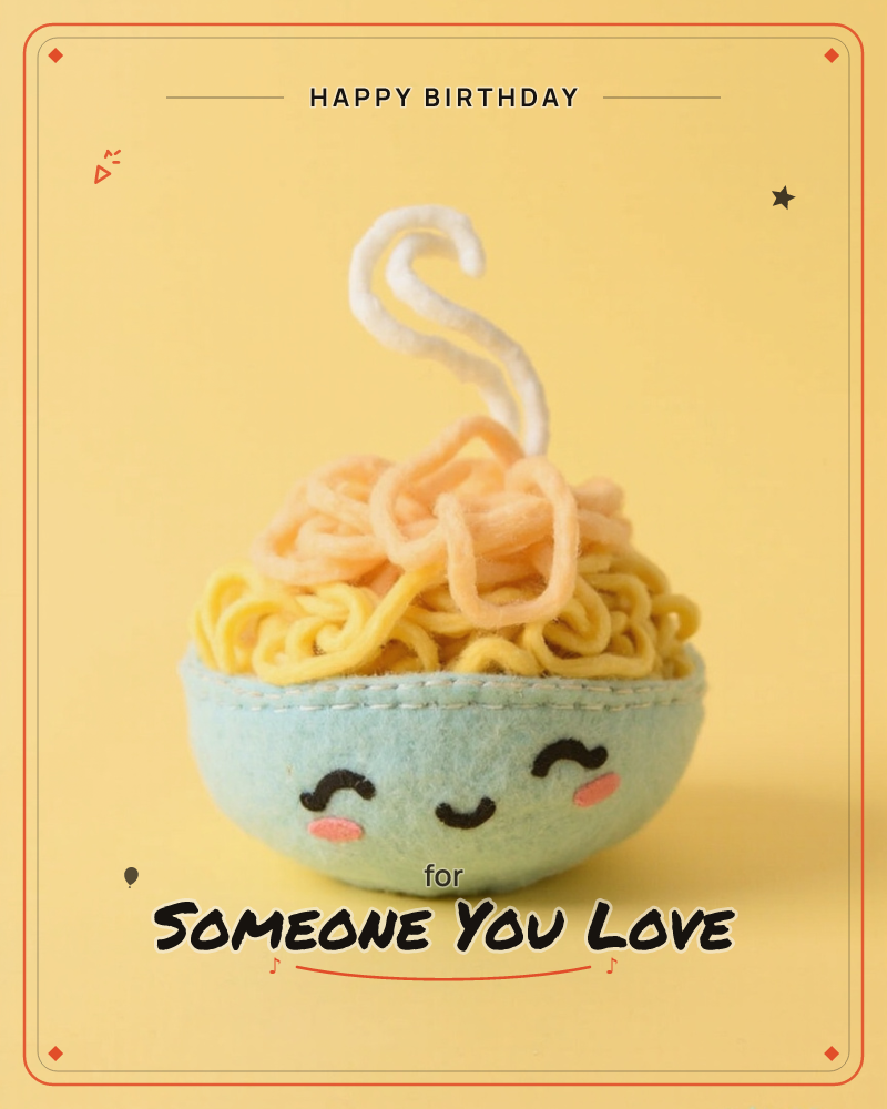 A felt bowl of noodles smiles up from a warm yellow background, its face stitched with rosy cheeks and closed happy eyes, a birthday e-card design