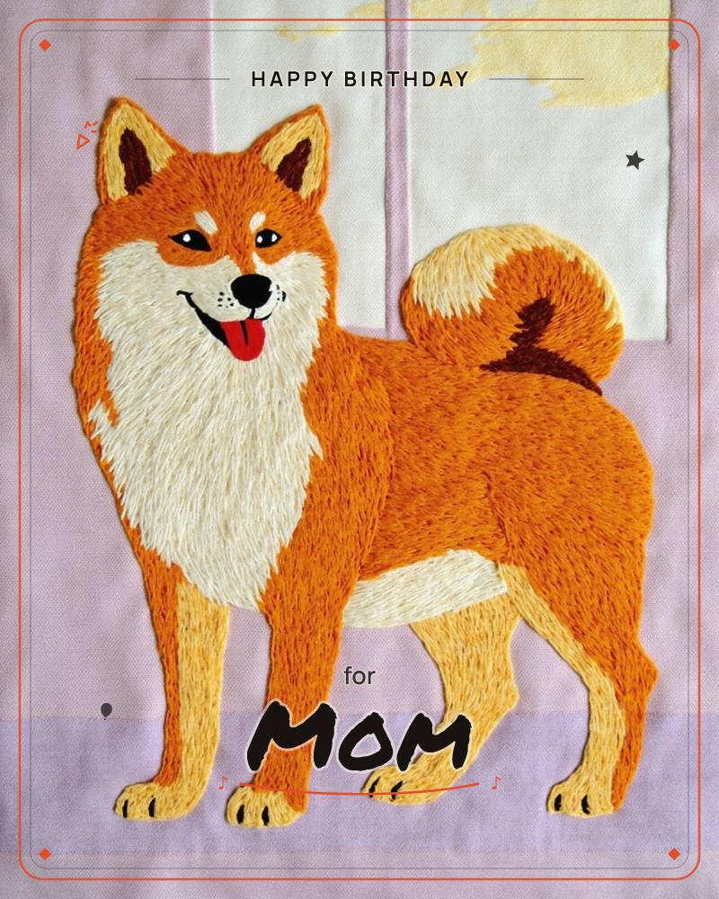 An embroidered shiba inu stands facing forward with tongue out and curled tail held high, its fur rendered in dense stitched threads of orange, cream…, a birthday e-card design
