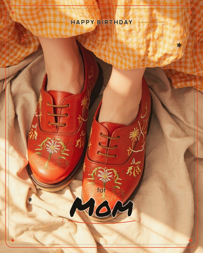 A close-up photograph of a pair of feet in red leather shoes painted with gold and green floral embroidery, peeking out from beneath an orange gingham…, a birthday e-card design