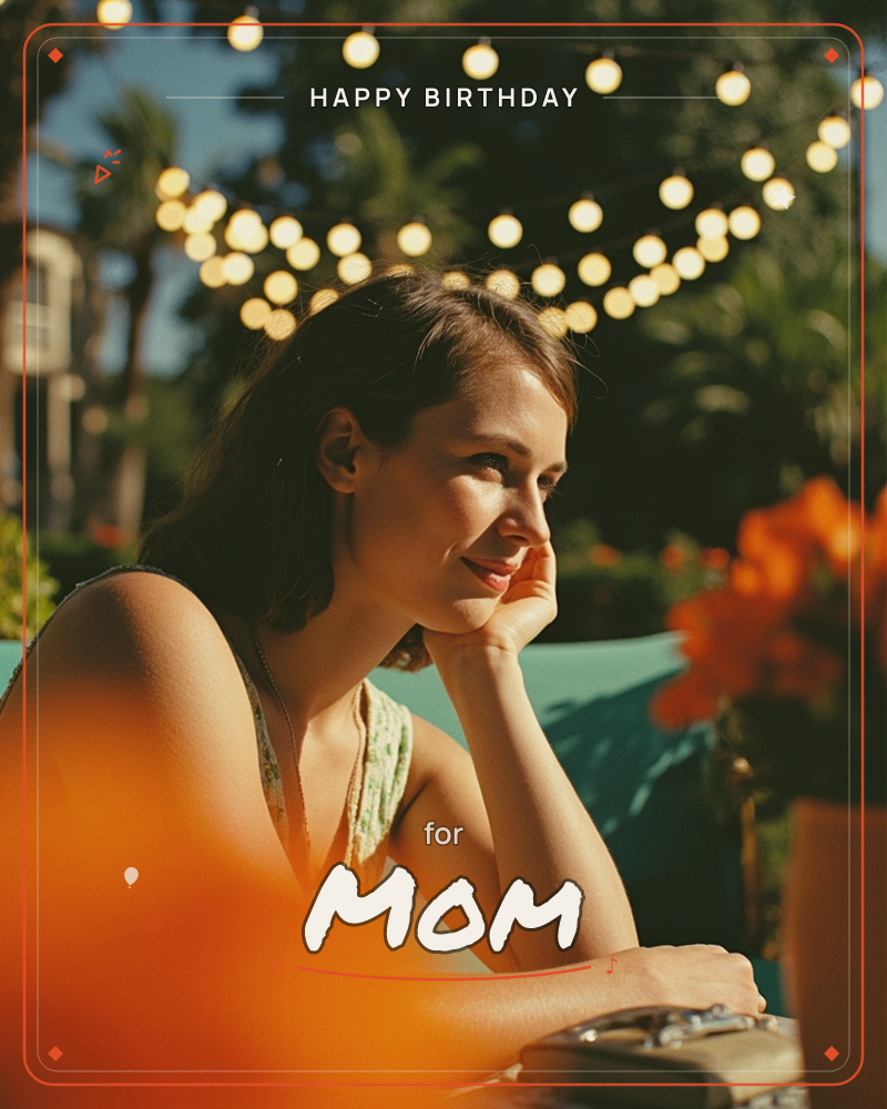 A woman rests her chin on her hand at an outdoor table, smiling softly as golden string lights glow above her in the fading evening light, a birthday e-card design