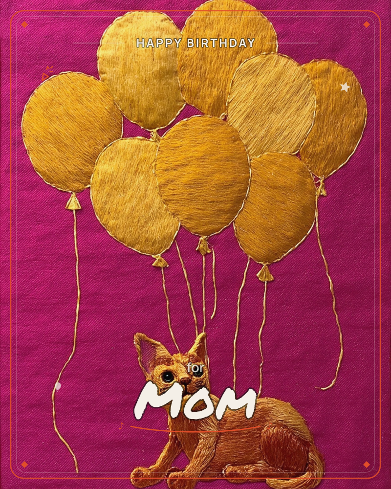 An embroidered cat with wide green eyes lies against a rich magenta fabric background, a cluster of golden-thread balloons floating above and tethered…, a birthday e-card design