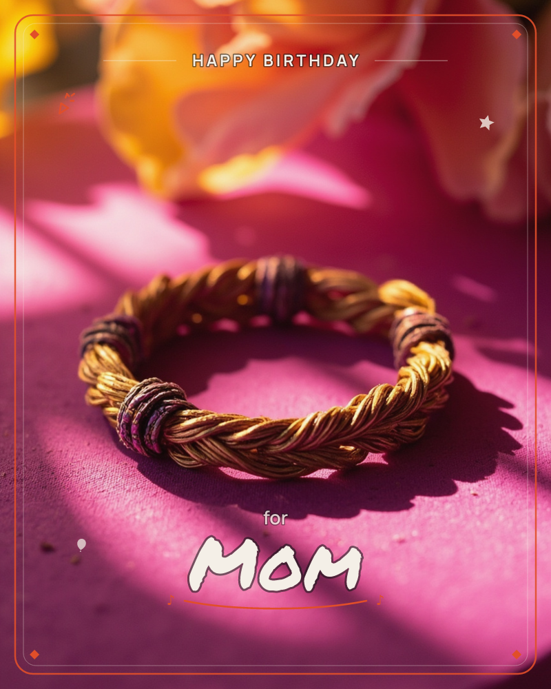 A twisted gold-toned bracelet, wrapped with small dark thread accents, rests on a vivid magenta surface in sharp raking sunlight, a birthday e-card design