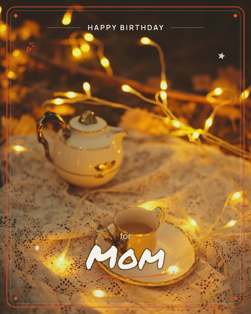 A porcelain teapot and teacup, both trimmed in gold, sit on a lace cloth strewn with warm fairy lights that glow like scattered embers, a birthday e-card design