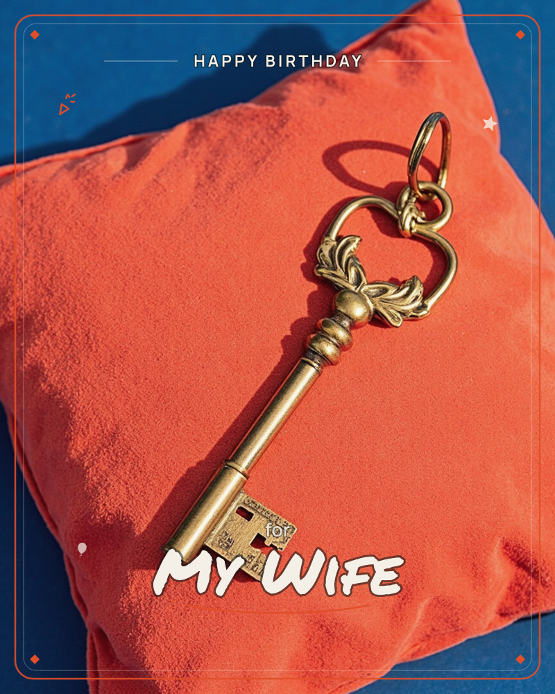 A large ornamental brass key with a heart-shaped bow rests diagonally across a plump orange velvet cushion, set against a deep blue background, a birthday e-card design