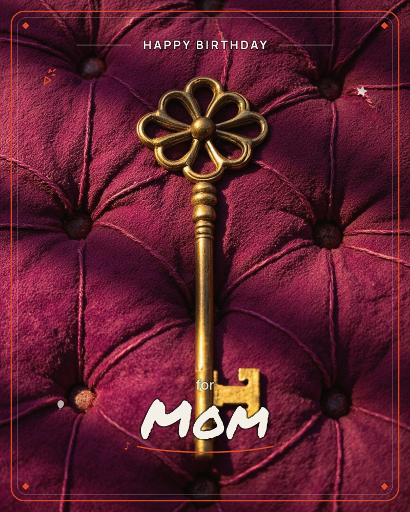 A single ornate brass key rests on deep magenta tufted velvet, its flower-shaped bow catching a warm slant of light, a birthday e-card design