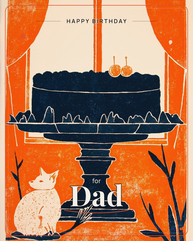 A dark iced cake topped with two cherries sits on a pedestal stand in front of a curtained window, rendered as bold linocut shapes in navy and burnt…, a birthday e-card design