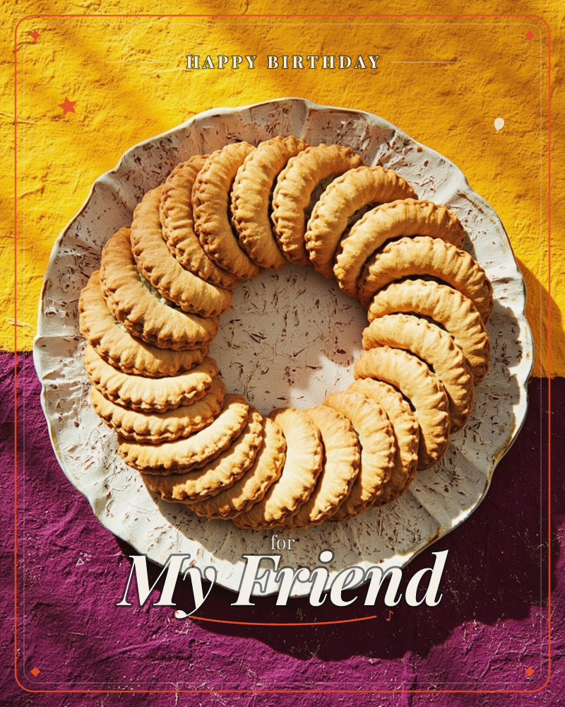 A ceramic scalloped plate holds a ring of crescent-shaped pastries, their crimped edges overlapping like a wreath, a birthday e-card design