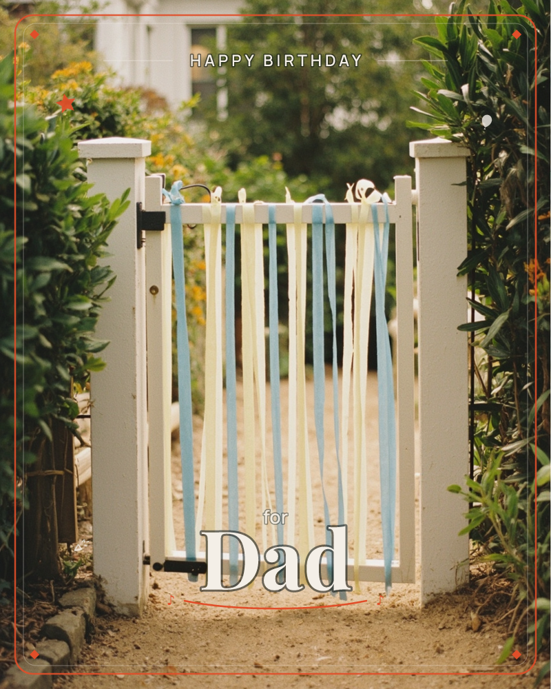 A white picket garden gate stands open, hung with long streamers of pale yellow and dusty blue ribbon fluttering in place of a wreath, a birthday e-card design