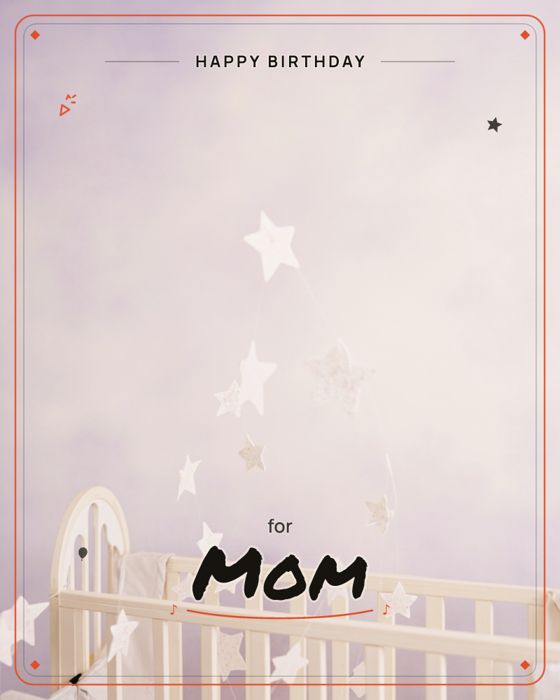A soft-focus photograph of a white wooden crib against a pale lilac wall, with a garland of white fabric stars trailing down from above and draped over…, a birthday e-card design