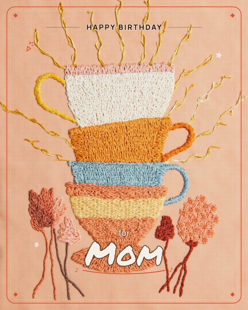 An embroidered stack of four mismatched teacups rises against a soft peach fabric background, gold thread swirling upward like steam or fireworks from…, a birthday e-card design