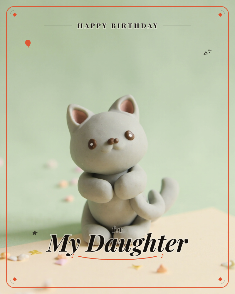 A little grey clay cat sits upright with its paws folded neatly in front, tail curled around its side, against a soft mint-green background and a cream…, a birthday e-card design