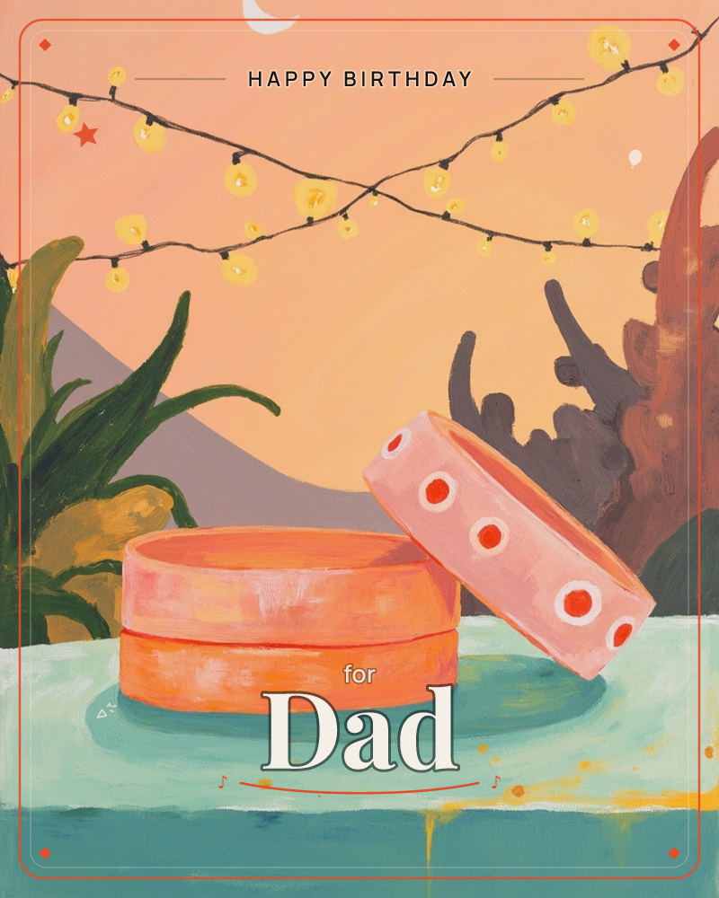 A round orange box with its polka-dotted lid propped open sits on a mint-green table under a string of glowing yellow fairy lights and a crescent moon, a birthday e-card design