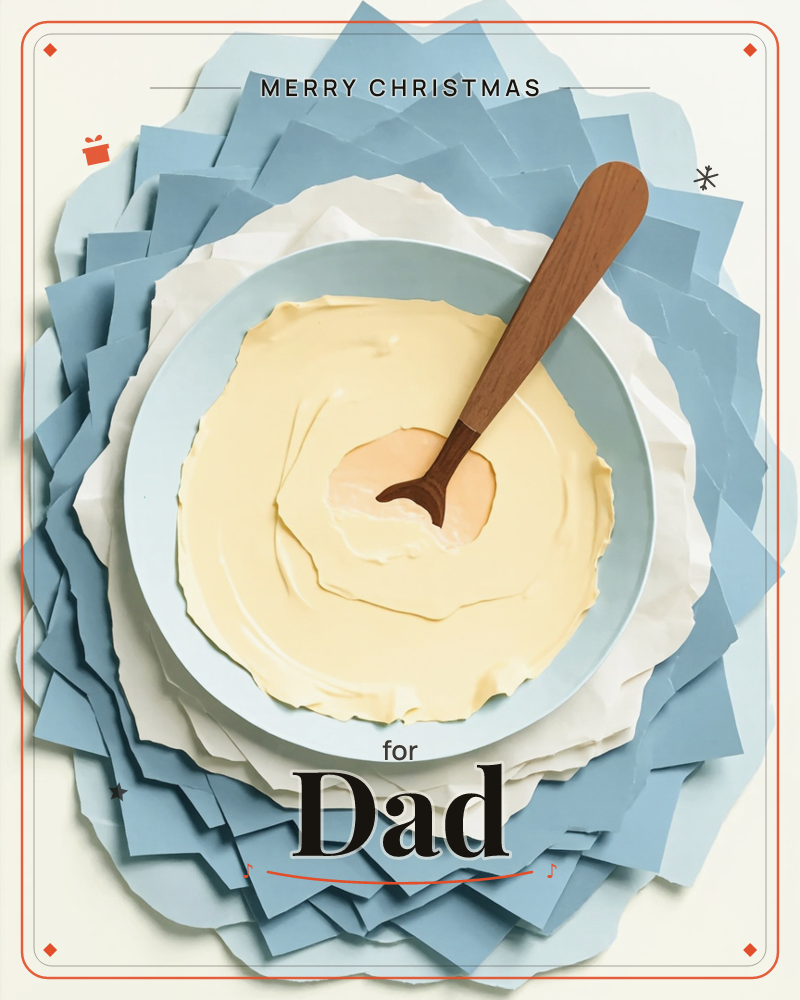 A pale blue mixing bowl full of creamy pale-yellow batter sits at the centre of a layered paper collage, its swirled surface marked with a wooden spoon, a christmas e-card design