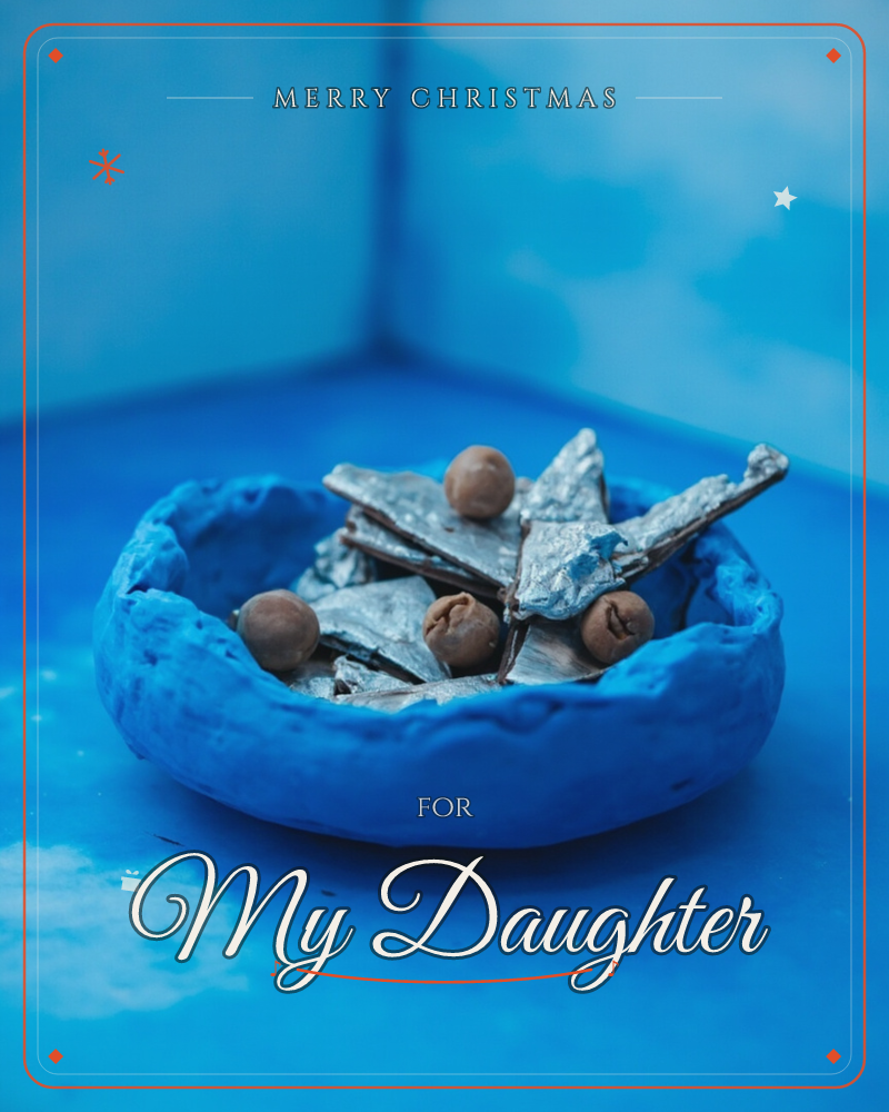 A rough-edged blue clay bowl sits in a painted blue corner, holding jagged shards of silver-dusted chocolate bark and a few round nuts, a christmas e-card design