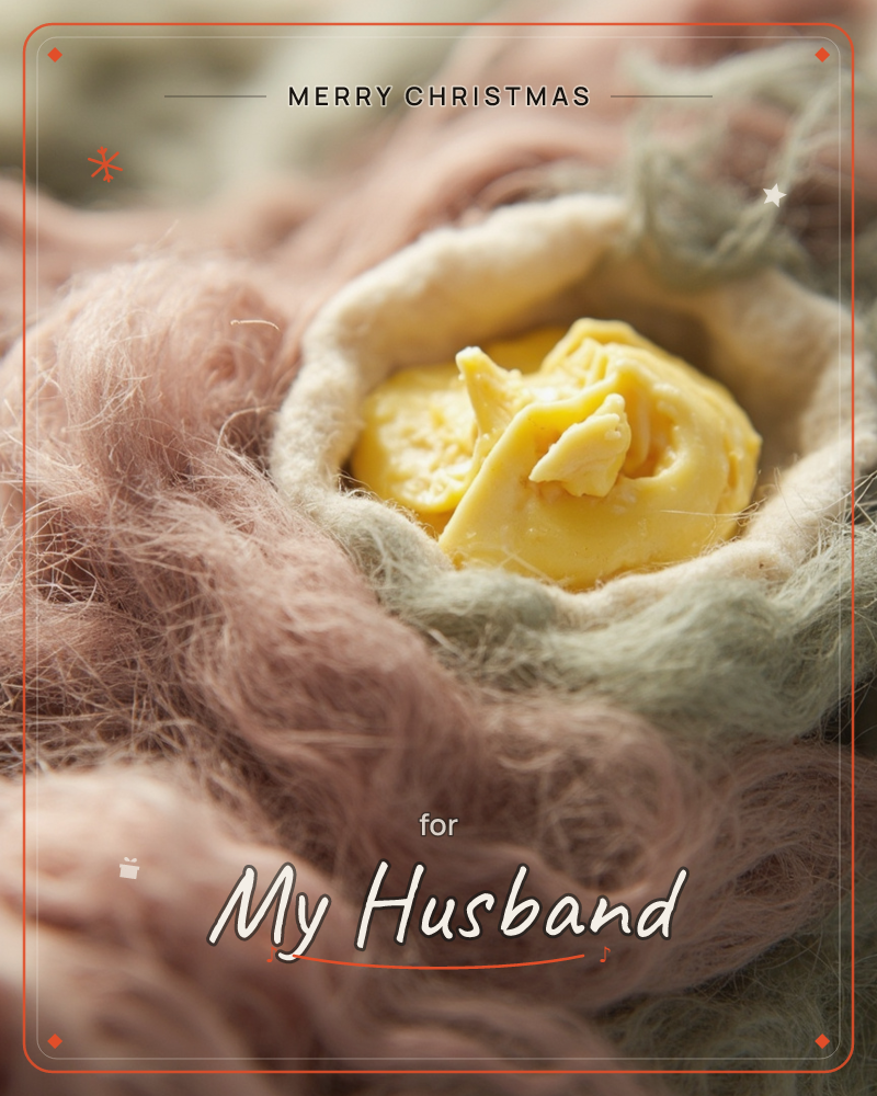 A close-up macro shot shows a felted, flower-like form nestled in soft drifts of wool fibre, with a golden-yellow felted centre cradled inside pale…, a christmas e-card design