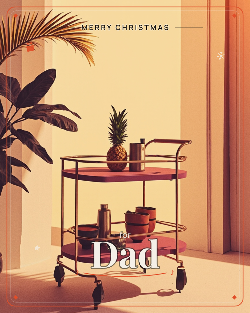 A retro two-tiered bar cart in deep maroon sits bathed in warm sunset light, holding a pineapple, a shaker, small bowls and stacked cups, a christmas e-card design