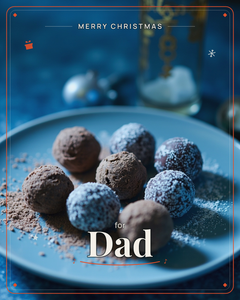 A plate of chocolate truffles sits dusted with cocoa powder and icing sugar, some dark and dusky, others frosted white like tiny snowballs, a christmas e-card design