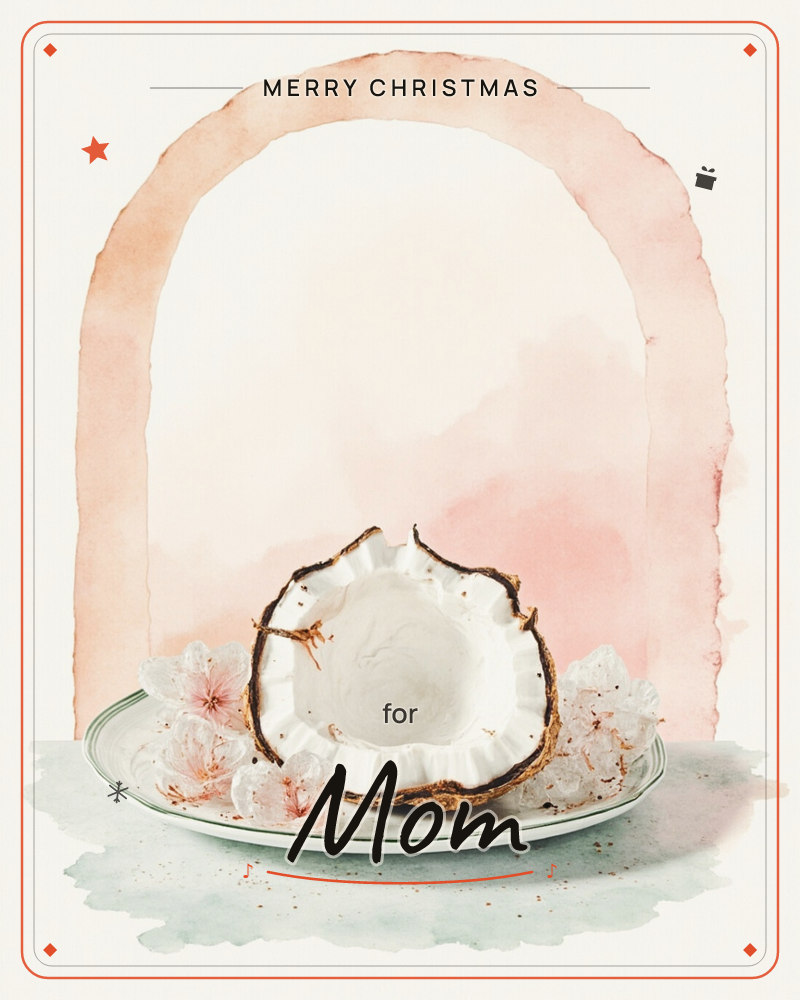 A halved coconut sits on a pale green-rimmed plate, its rough brown husk framing bright white flesh, flanked by soft pink and white blossoms, a christmas e-card design