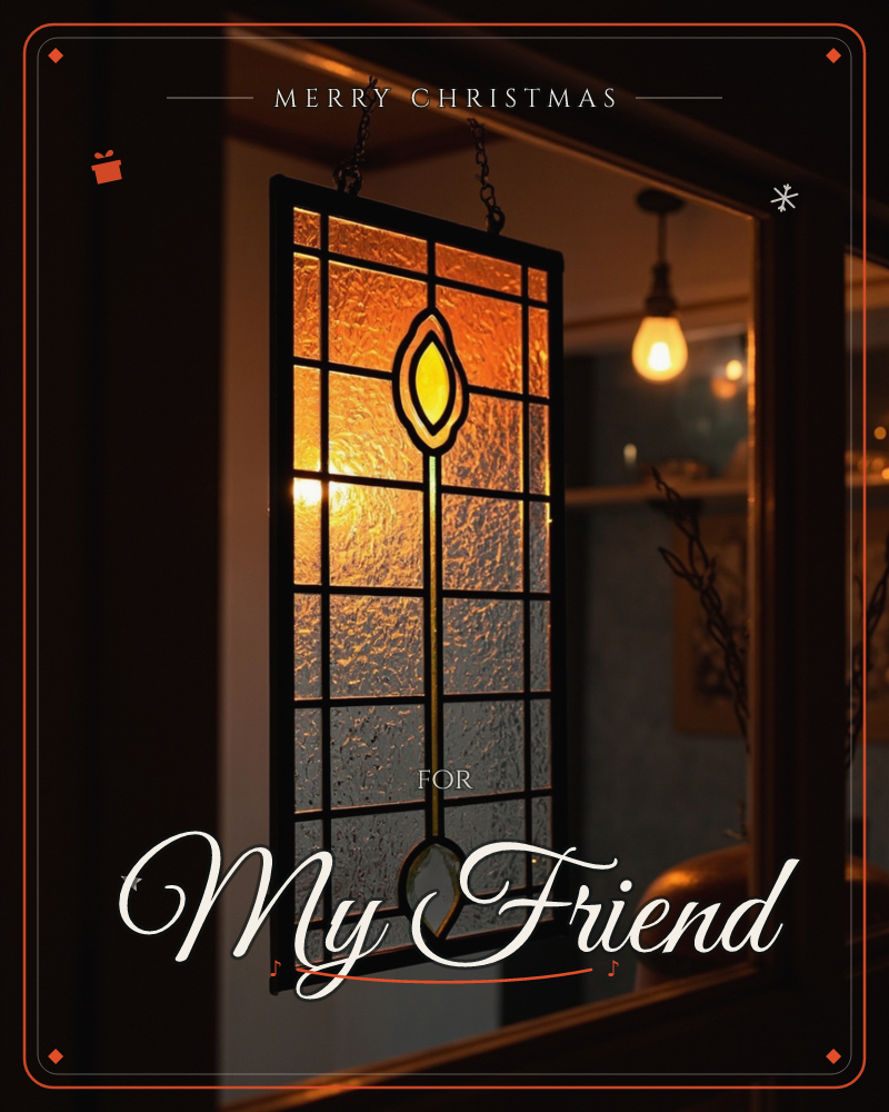 A leaded stained-glass panel hangs by chains inside a dark window, its grid of small amber and clear panes glowing from a warm light behind, a christmas e-card design