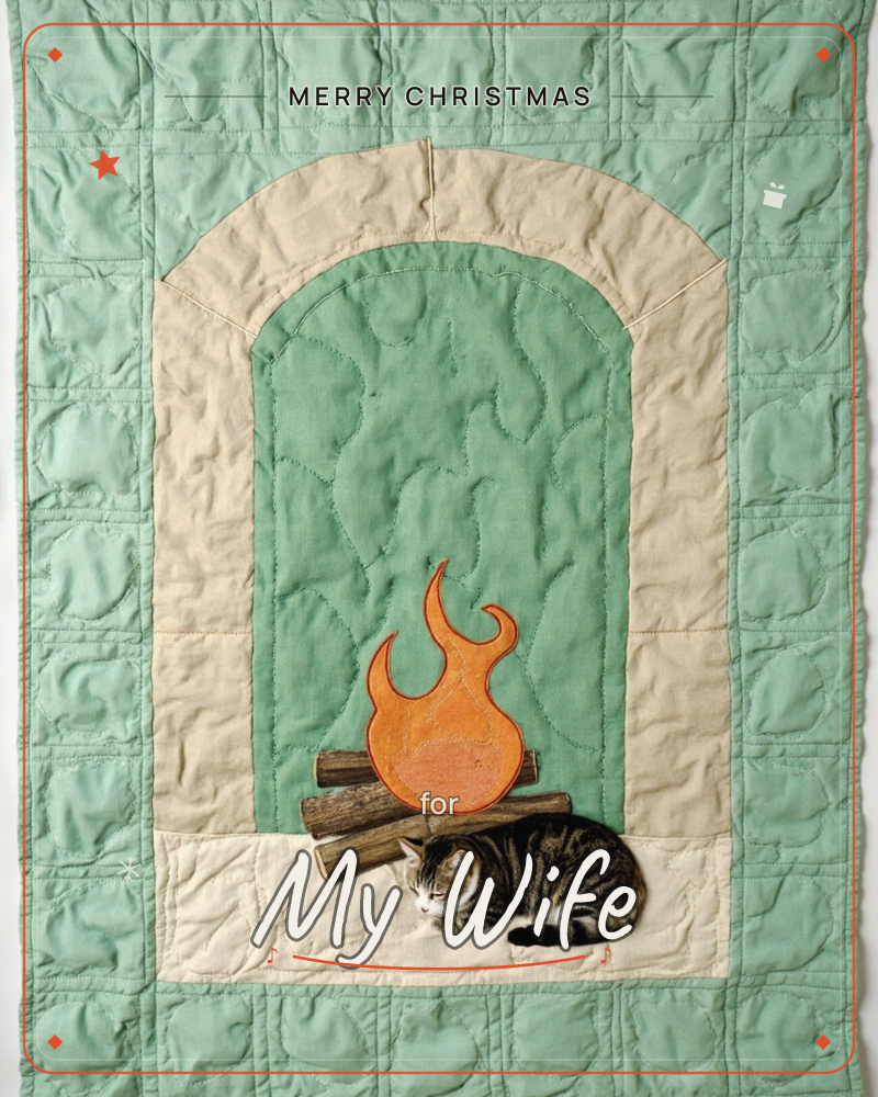 A quilted textile illustration shows a stitched fireplace archway in sage green and cream, with an appliquéd orange flame licking up over patchwork logs, a christmas e-card design