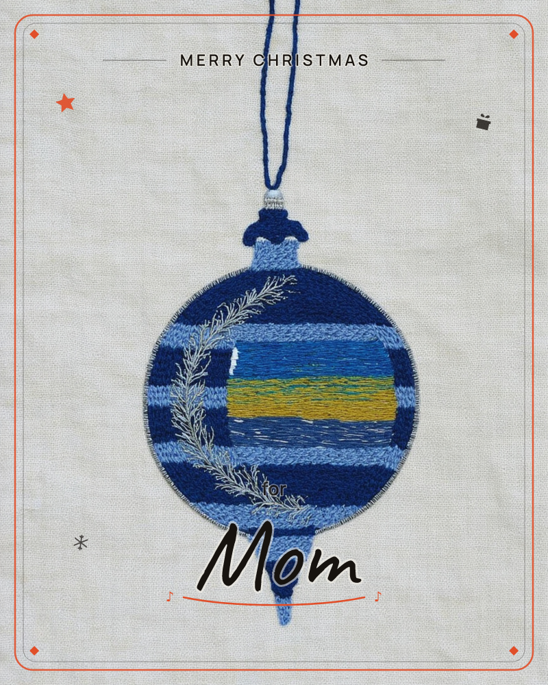 An embroidered Christmas ornament sits stitched onto pale linen, its round body striped in shades of blue with a glinting gold band and a silvery fir…, a christmas e-card design