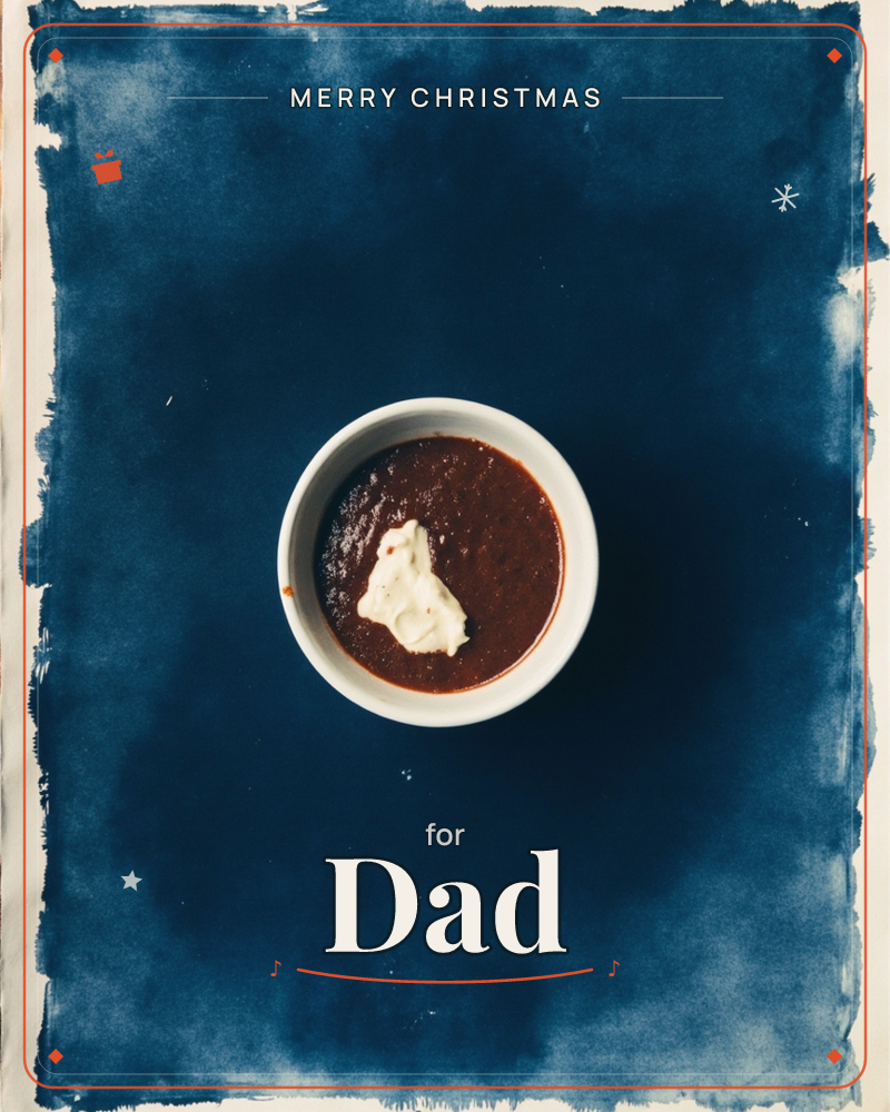 A small white bowl of dark, rich stew or chili topped with a dollop of cream sits centered on a deep indigo cyanotype-style background, its edges…, a christmas e-card design