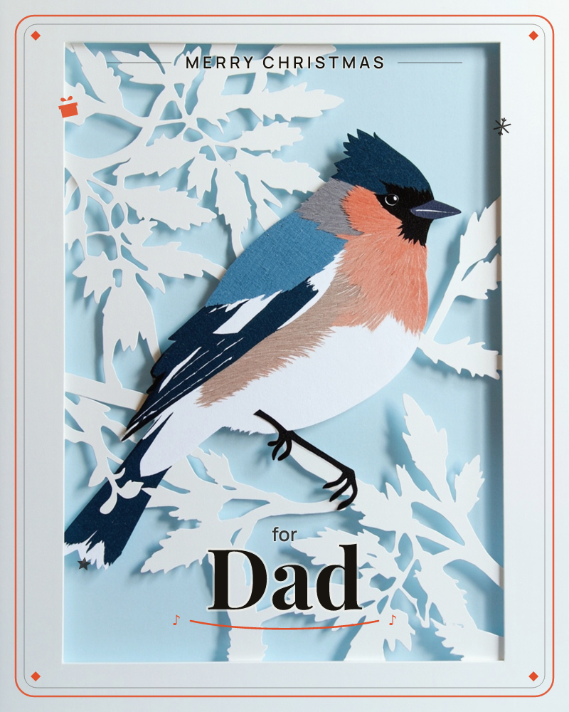 A layered paper-cut bird, its chest a soft peach and wings a deep blue-black, perches among white silhouette leaves against a pale sky-blue background, a christmas e-card design