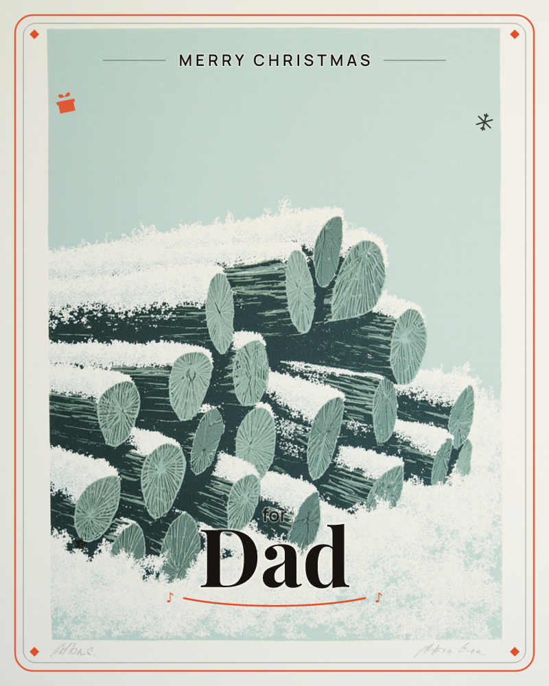A stacked pile of cut logs sits dusted with snow against a pale, flat winter sky, a christmas e-card design