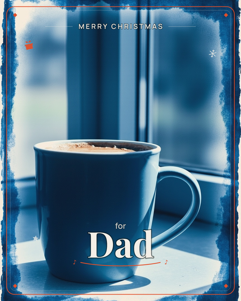 A blue ceramic mug of coffee sits on a sunlit windowsill, its foam catching a warm light against the cool glass behind it, a christmas e-card design