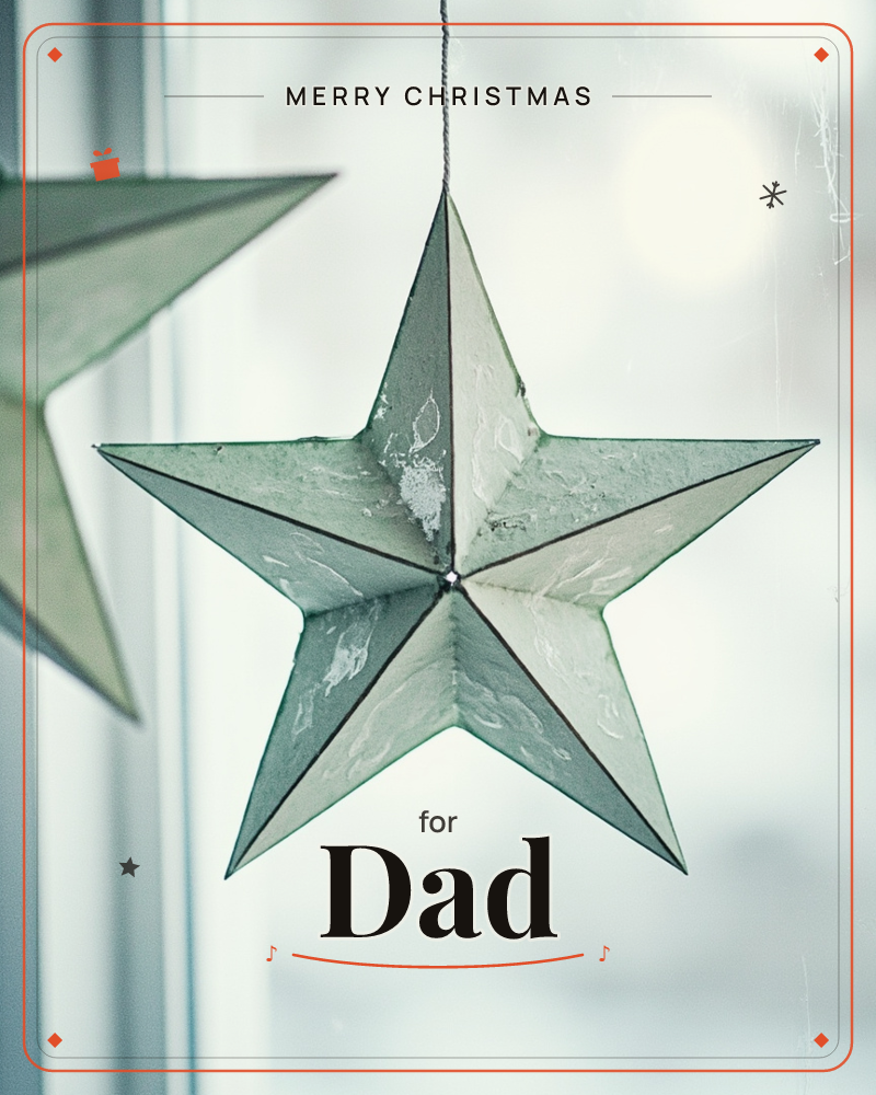 A folded paper star hangs by a thread in front of a softly blurred window, its textured panels catching pale winter light, a christmas e-card design