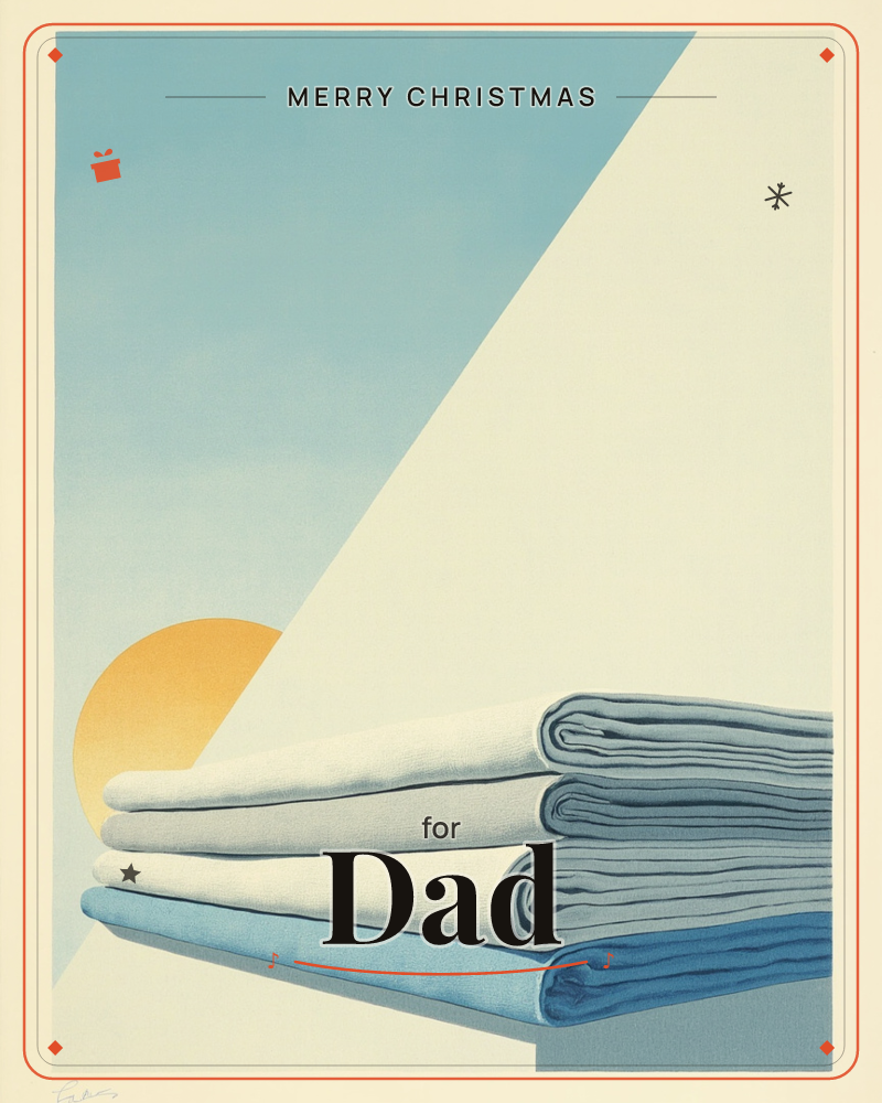 A stack of neatly folded linens sits on a ledge against a graphic sky, a soft orange sun glowing behind a sharp diagonal shadow, a christmas e-card design