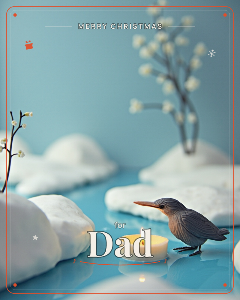 A small kingfisher figurine stands on a glassy pale-blue surface beside a lit tealight, surrounded by soft white snow-like mounds and bare branches…, a christmas e-card design