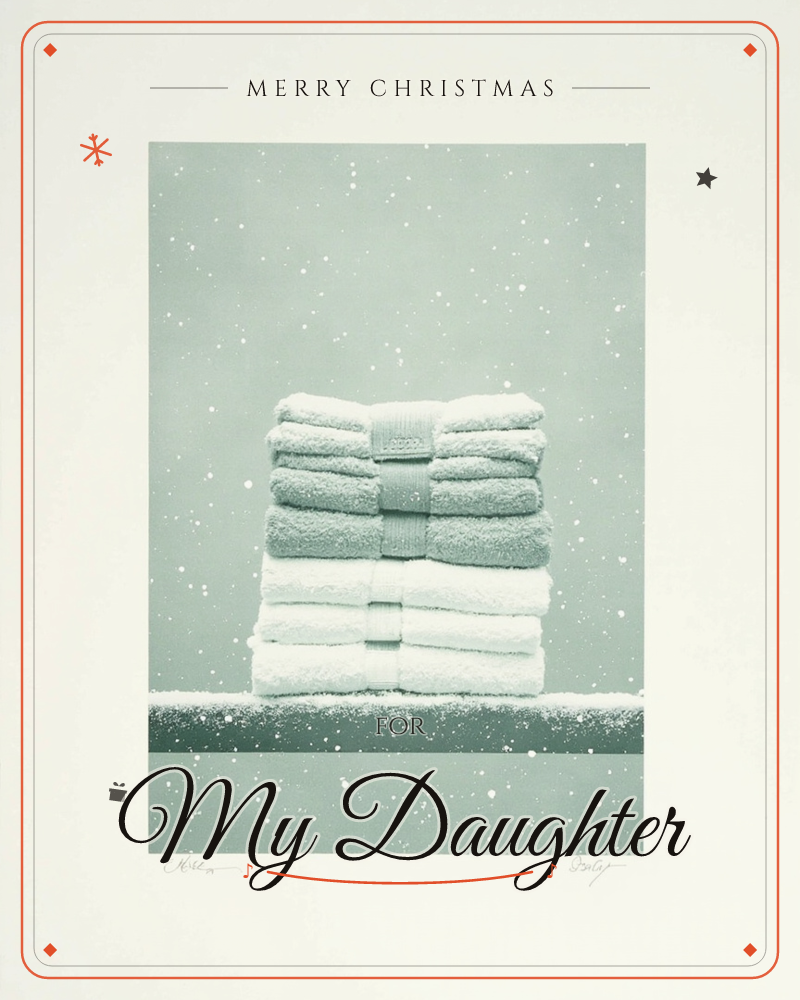 A neat stack of folded towels, banded in two bundles of white and sage green, sits on a narrow ledge as snow falls softly against a muted green backdrop, a christmas e-card design