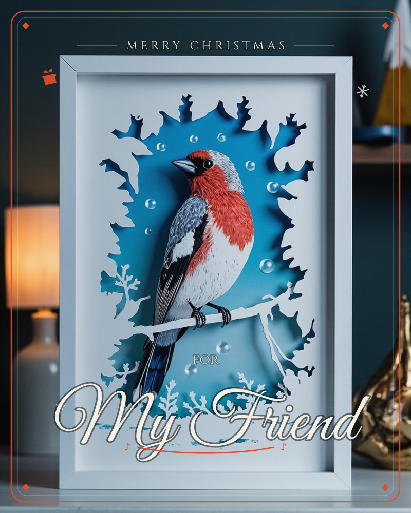 A framed papercraft illustration shows a bullfinch with a rosy red breast perched on a bare branch, set against a layered blue background cut with…, a christmas e-card design
