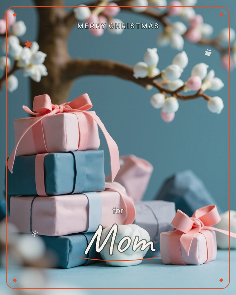A stack of glossy fondant-look gift boxes in dusty pink and slate blue leans beside a smaller matching box, tied with satin pink ribbons, a christmas e-card design