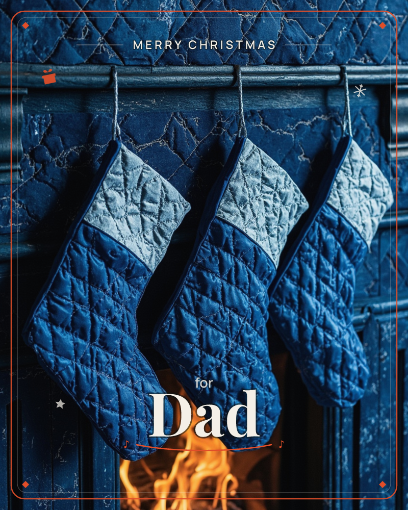 Three quilted stockings in deep navy with pale grey cuffs hang from a carved mantelpiece, its surface painted the same rich blue and finely cracked…, a christmas e-card design
