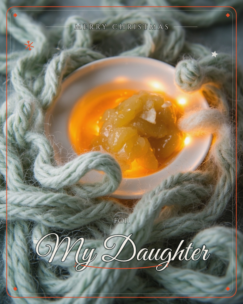A close-up photograph shows a small white dish glowing with warm amber light, holding what looks like a piece of preserved fruit or amber resin…, a christmas e-card design