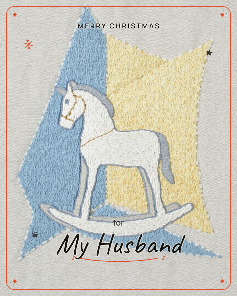 An embroidered rocking horse in white and grey thread sits against a jagged backdrop of stitched blue and pale yellow triangles on soft grey fabric, a christmas e-card design