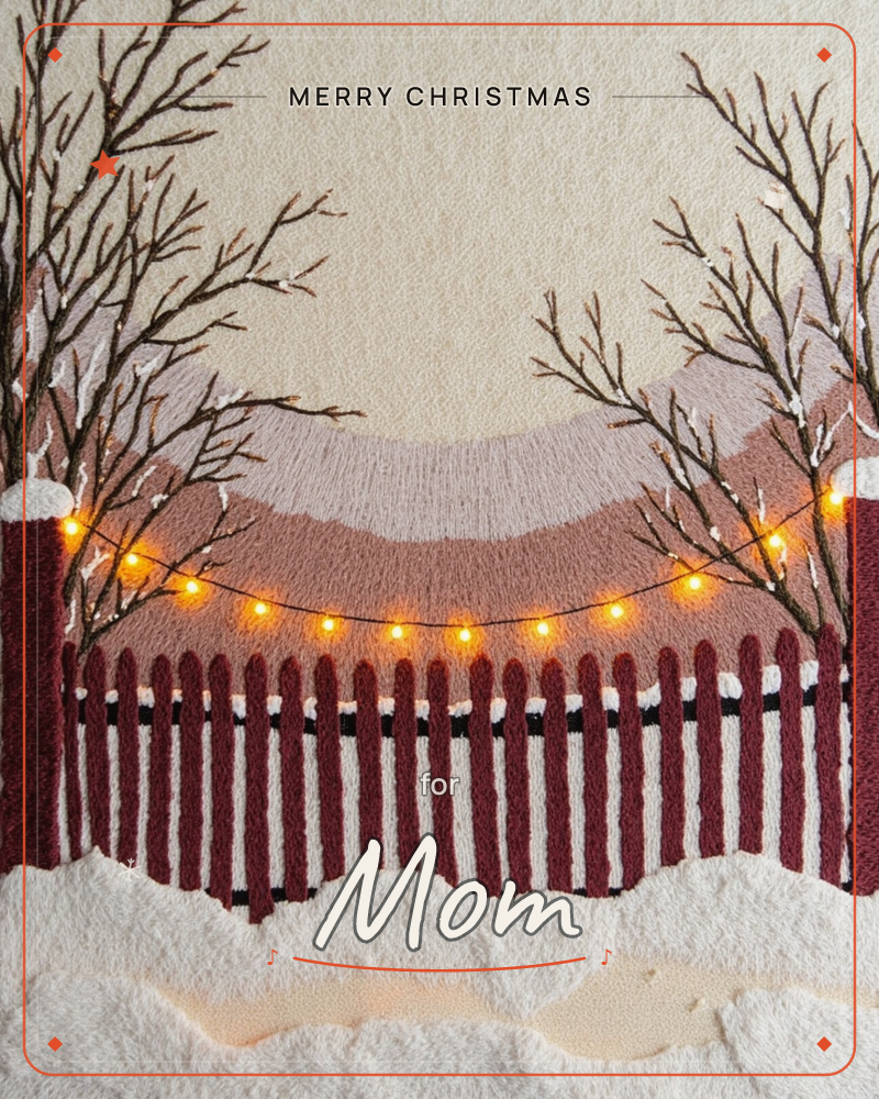 A textured embroidery-style card shows a deep red picket fence draped in a glowing string of warm fairy lights, framed by bare snow-dusted branches…, a christmas e-card design
