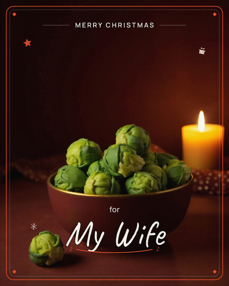A moody still life shows a gold-rimmed maroon bowl piled high with fresh brussels sprouts, one sprout rolled loose onto the dark tabletop, a christmas e-card design