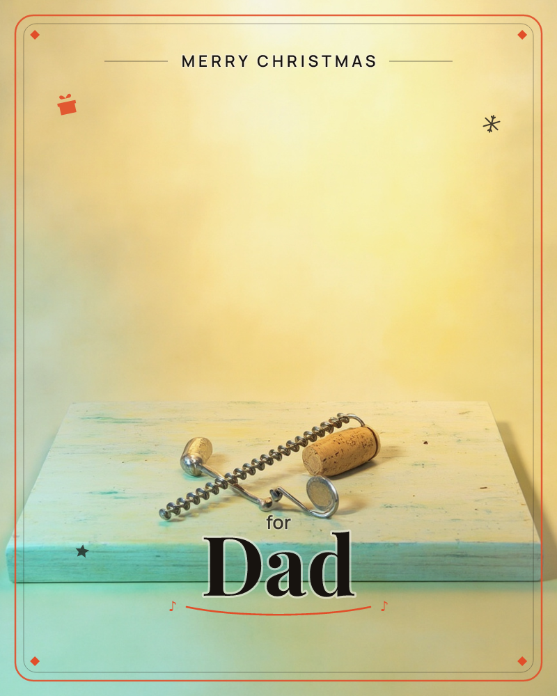 A metal corkscrew rests beside a used wine cork on a pale, weathered wooden board, lit against a soft glowing amber-yellow backdrop, a christmas e-card design