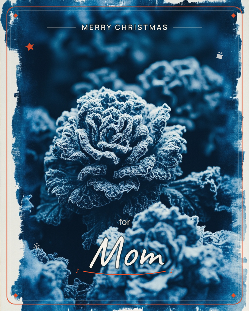 A close-up cyanotype-style print shows frost-rimmed roses in deep indigo blue, their ruffled petals traced with white crystalline edges, a christmas e-card design