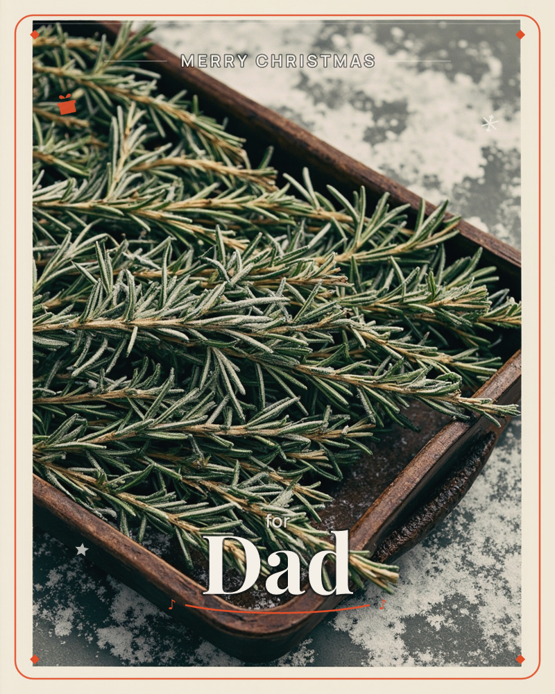 A close-up photograph shows fresh rosemary sprigs piled onto a weathered dark wooden tray, their needles dusted with frost or fine flour, a christmas e-card design