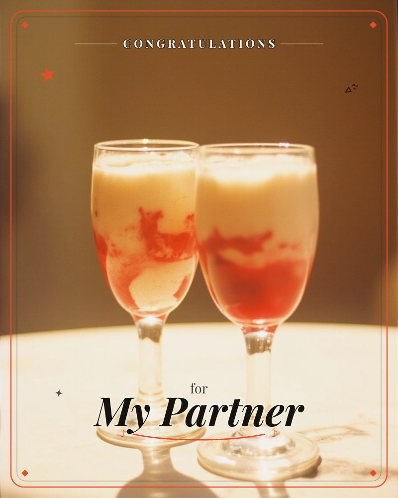 Two glass stemmed dessert glasses stand side by side on a pale round table, filled with creamy custard swirled through with streaks of red berry sauce, a congratulations e-card design